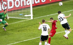 Mario Gomez loses his marker to head home Germany's winner